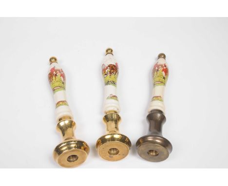 A group of three ceramic beer pump pull handlesWith brass fittings, white ceramic handles detailed with huntsmen and hounds b