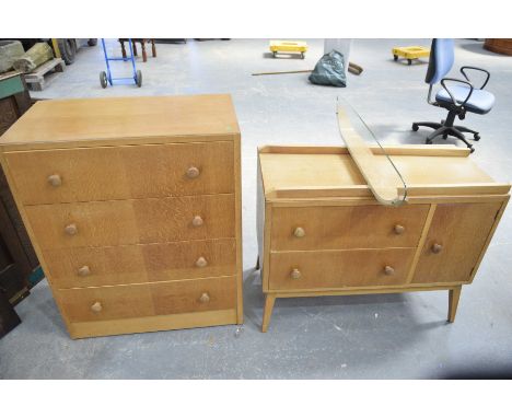 A 1960's/1970's light oak two piece bedroom suite by Herbert E GibbsComprising a chest of four drawers with turned button han