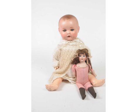 A German bisque headed shoulder dollWith dark brown wig, open/shut blue eyes, impressed mark AM CED 93 FDEP with porcelain lo