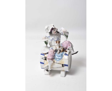 A continental porcelain figural lidded boxModelled on a musician figure, in elaborate attire, playing flute and cymbals, with