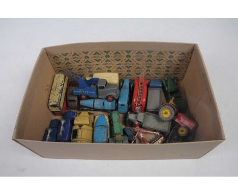 Nineteen unboxed Dinky diecast vehiclesOf various types and various ages - playworn, including tractor, disc harrows, ambulan