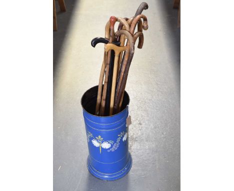 A bargeware style enamel stick standThe blue stand with foliate design, together with a quantity of various sticks, height of