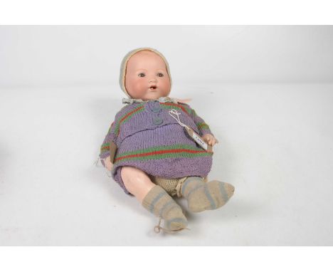 A German bisque headed My Dream Baby dollWith open/shut brown eyes, open mouth, impressed marks A.M. Germany 351./6.K, with c