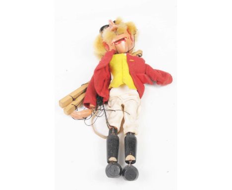 A boxed Pelham Puppet type SM 'Huntsman'With beak nose, red jacket and white trousers, in original plain box with printed lab