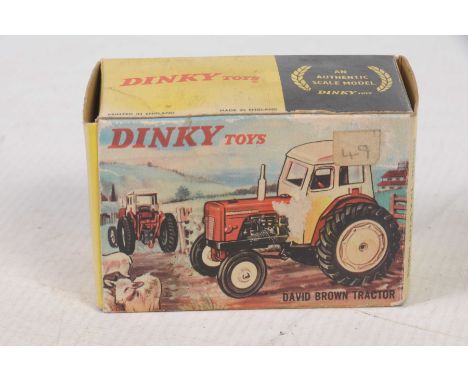Two boxed Dinky tractorsComprising Dinky no. 305 'David Brown' tractor, finished in white including hubs, lacking chimney sta