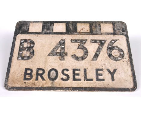 A vintage cast iron road sign The road sign painted in black and white, with raised lettering 'B4376 Broseley' 33cm x 50.5cm.