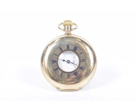 A 9k gold half hunter pocket watch The dustcover with open aperture, and enamelled Roman numerals, revealing white enamel dia