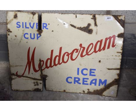 A vintage enameled advertising sign  'Medow Cream' the rectangular sign with a cream background and blue lettering 'Silver cu