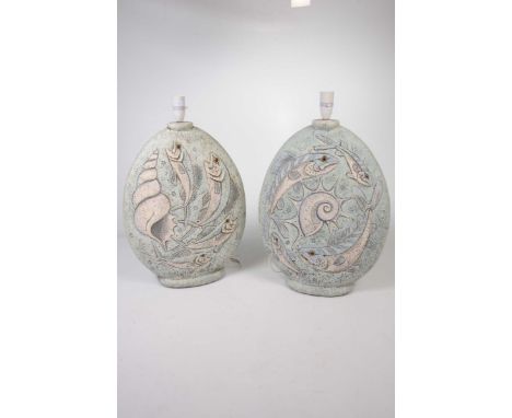 A matched pair of contemporary ceramic lamp basesThe lamp bases of oval form, on a light turquoise ground, decorated in relie