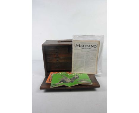 A mahogany Moore & Wright tool chest with drawers containing a quantity of Meccano including some early examplesTogether with
