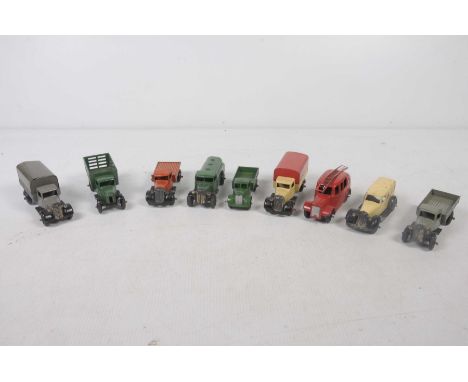 Nine unboxed Dinky early post-war commercial vehiclesIncluding ambulance, fire engine, petrol tanker, two covered wagons, thr