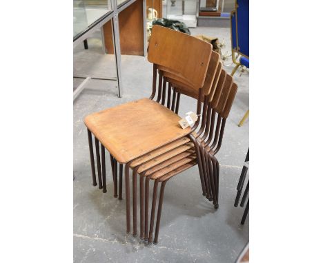 A set of six vintage stacking school chairsEach with a concave hardwood back and seat raised on a tubular metal frame, 77cm h