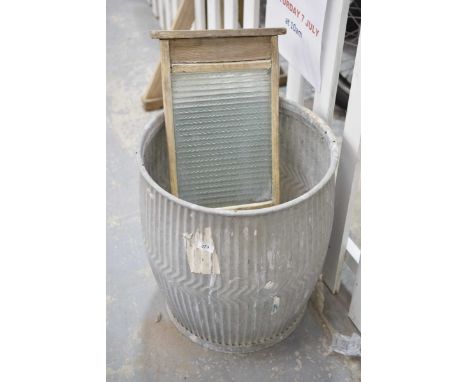 A galvanized dolly tubOf typical swelling form along with a vintage washboard, galvanized two handled tub and galvanized cyli