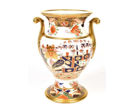 An English porcelain Derby style pedestal vaseTypically decorated with formal fenced gardens, bamboo, chrysanthemum and lotus