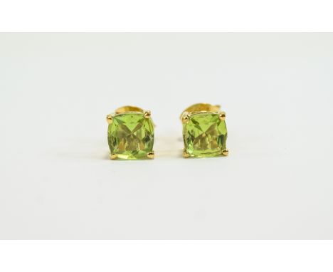 Peridot Pair of Stud Earrings, cushion cut solitaires totalling 2cts, set in 14ct gold vermeil and silver post and push back 