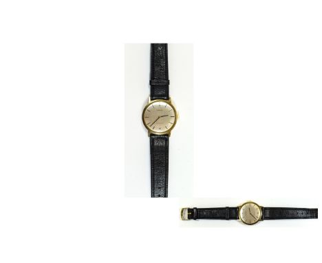 Gents 9ct Gold Tissot Wristwatch, Silvered Dial With Gilt Baton Numerals & Hands, Manual Wind, On A Black Leather Strap. Watc