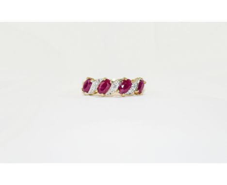 9ct Gold Diamond and Ruby Cluster Ring. Features 4 oval rubies between diamond chip inserts in raised setting.