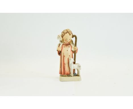 Hummel Figure Shepherd Figure. Embossed to base M.J. Hummel, features a child shepherd in orange robe with staff and two lamb