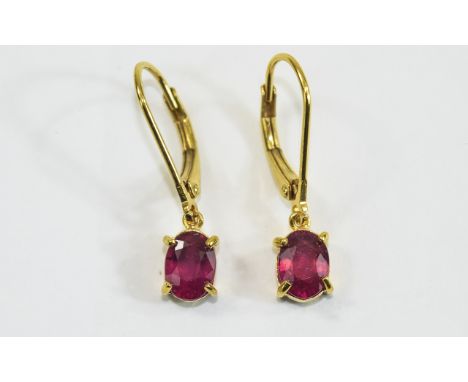 Ruby Pair of Drop Earrings, two solitaire, oval cut, rich red rubies, totalling 2.25cts, set in 14ct gold vermeil and silver 