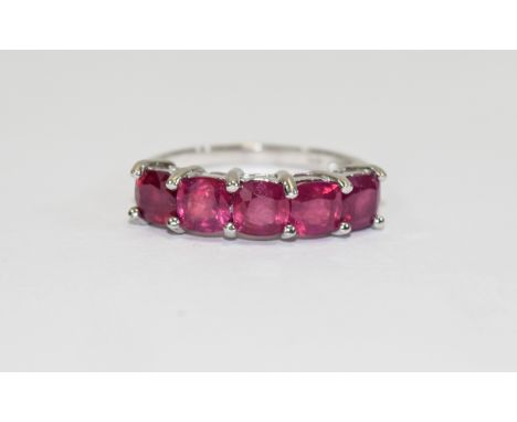 Ruby Five Stone Band Ring, comprising five cushion cut rubies of equal size and good colour, totalling 3.75cts, set in rhodiu