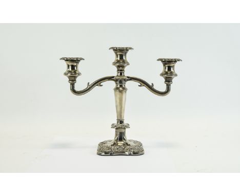 Candle Stick Plated three armed candle stick on square base with grape and vine leaf embossed design.