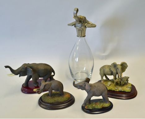 Glass Decanter with Elephant Stopper stamped MIKA, measures 32cm approx. together with a selection of Elephant statues includ