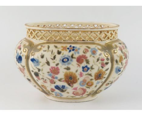 A Zsolnay Pecs oval posy vase, with pierced rim, the body of lobed oval form, decorated with floral sprays, 18cm wide 