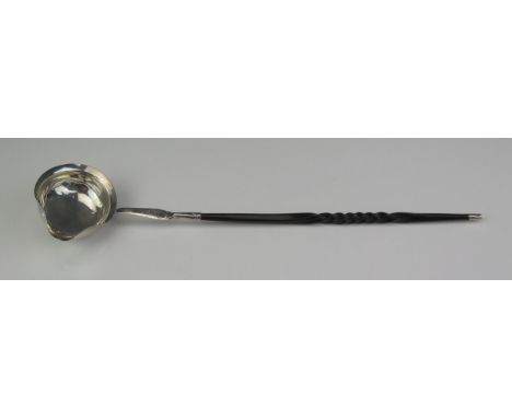 A Georgian silver toddy ladle, unmarked, initialled, the bowl of oval outline, mounted on a spiral twist baleen handle,  35cm