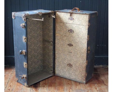 An American Hartmann metal and canvas bound steamer trunk, with two hinged doors, enclosing four fitted drawers and hanging s