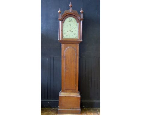 N. Adams, Stowmarket, a George III oak longcase clock, the arched hood with ball and spire finials and turned columns, the tr