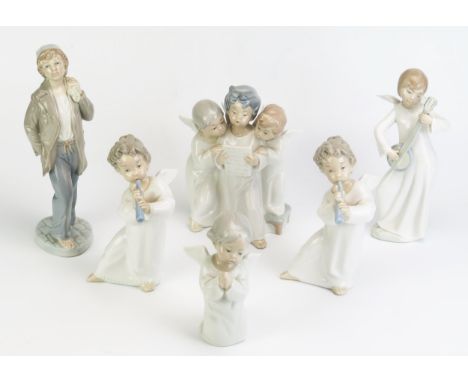 Five Lladro and Nao porcelain figurines including street urchin, angels playing musical instruments and praying. 