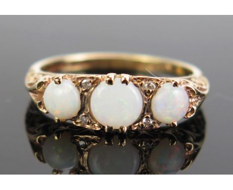 A 9ct Gold, Opal and Diamond Ring, hallmarked, size K.5, c. 2.09g 