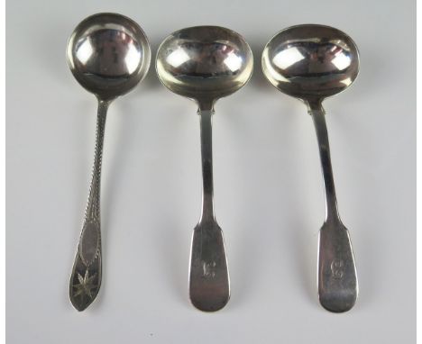 A pair of Victorian silver Fiddle pattern sauce ladles, maker T.W, London, 1853, initialled, together with another silver sau