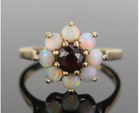 A 9ct Gold, Garnet and Opal Cluster Ring, 12.5mm head, hallmarked, size N.5, c. 2.69g 