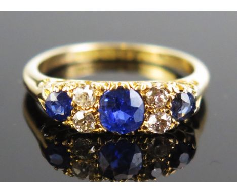 An Antique 18ct Gold, Sapphire and Cushion Cut Diamond Ring, c. 5mm principal stone, Birmingham 1910, size L.5, c. 3.81g 