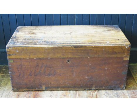 A camphor wood rectangular travelling trunk, with hinged lid and metal loop handles to the sides, 95cm wide. 