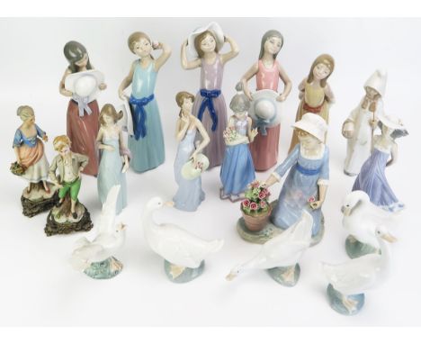 A collection of Lladro and Nao porcelain figurines, mostly of young girls and geese, together with two Capo de Monte figurine