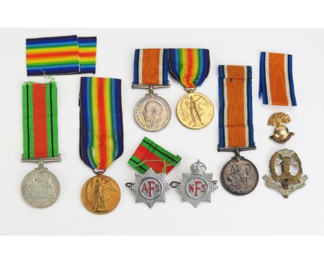 A World War One paiR to 134334. GNR. H.W. SMITH. R.A., another pair to G.58825. PTE. F.A. SMITH. MIDD'X R., a Defence Medal. 