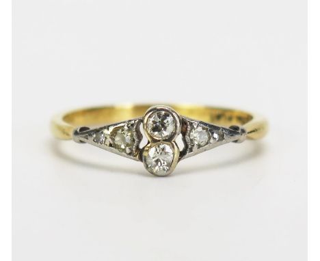 A Diamond Ring in an 18ct gold and platinum rub over setting, size N.5, 2.29g 