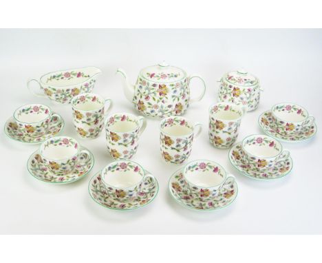A Minton part tea service with "Haddon Hall" transfer print decoration, includes, Tea pot, sugar basin, cream jug, mugs, cups