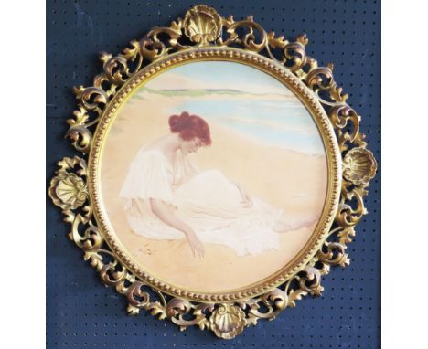 A vintage print of a c.19th seated lady on the beach holding a shell, 42 x 42cm, ornate carved gilt and gesso frame 