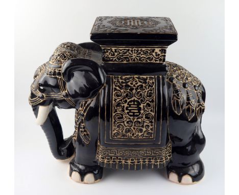 A large modern Chinese pottery jardiniÃ¨re stand in the form of elephant, with polychrome decoration,  43cm high. 