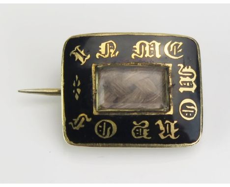 A William IV Black Enamel Memorial Brooch in an unmarked yellow metal setting with platted hair to the central glazed panel, 