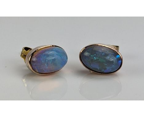 A Pair of Opal Stud Earrings in an unmarked precious yellow metal setting, 9x5mm stones, 1.83g 