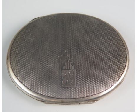 A George VI silver compact, maker William Suckling Ltd, Birmingham, 1946, initialled, of oval outline with engine turned deco