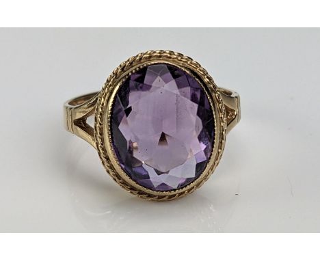 A 9ct Gold and Amethyst Dress Ring, c. 11.5x10mm stone, hallmarked, size L.75, c. 3.81g 