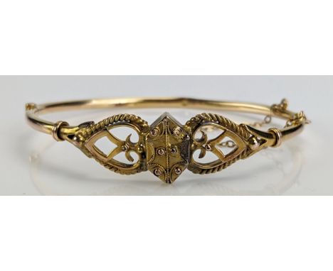 A Victorian 9ct Gold Hinged Bangle, c. 6.56g, boxed. Some dents 