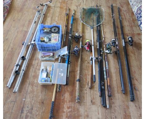 A collection of assorted sea rods and reels, including boat rods and beach rods, includes four fixed spool reels, multiplying