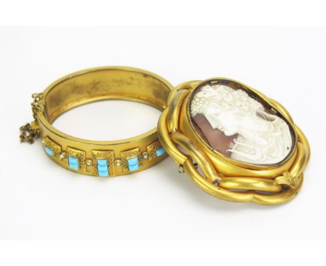 A Victorian Gilt Metal Turquoise Glass and untested Pearl Hinged Bangle and a Victorian Pinchbeck swivel memorial brooch deco
