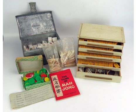 A Mahjong set contained in a fitted case, together with another Mahjong set. (2). 